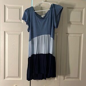 From Umgee USA, this is a flowy, mini three-toned blue cute sundress!